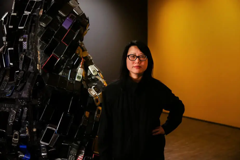 Portrait of artist Jean Shin in front of her solo exhibition now on view at the Asian Art Museum.
