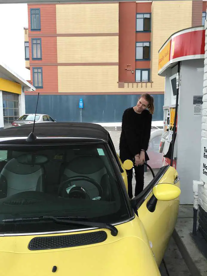 Pumping gas into a Getaround during on sponsored story with the brand.