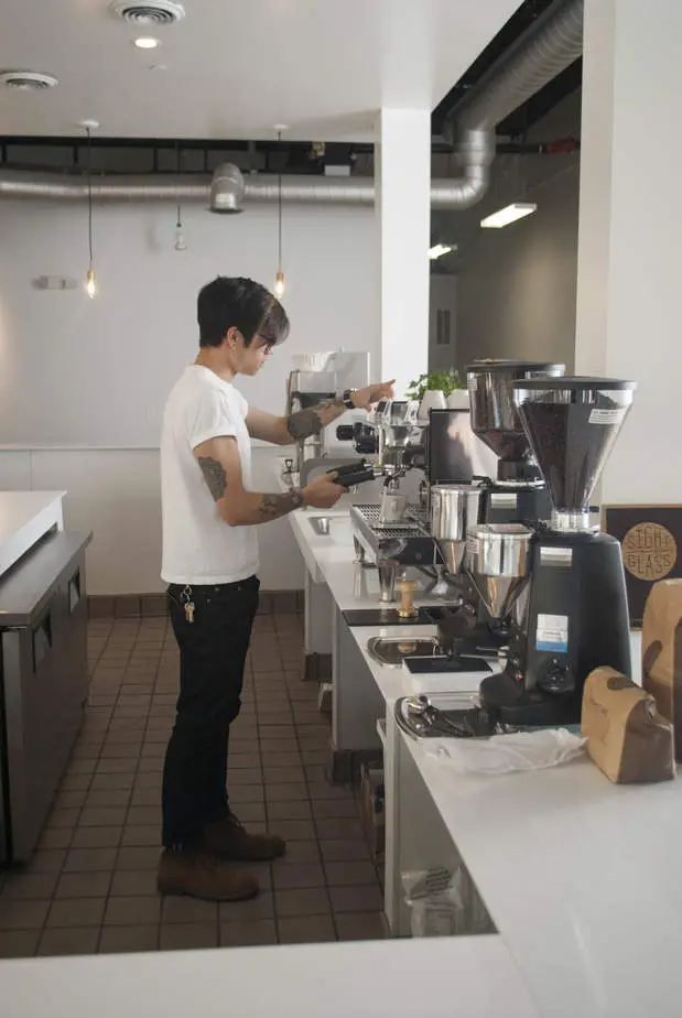 One of the Sightglass in-house baristas making sure the machines are calibrated for opening day.