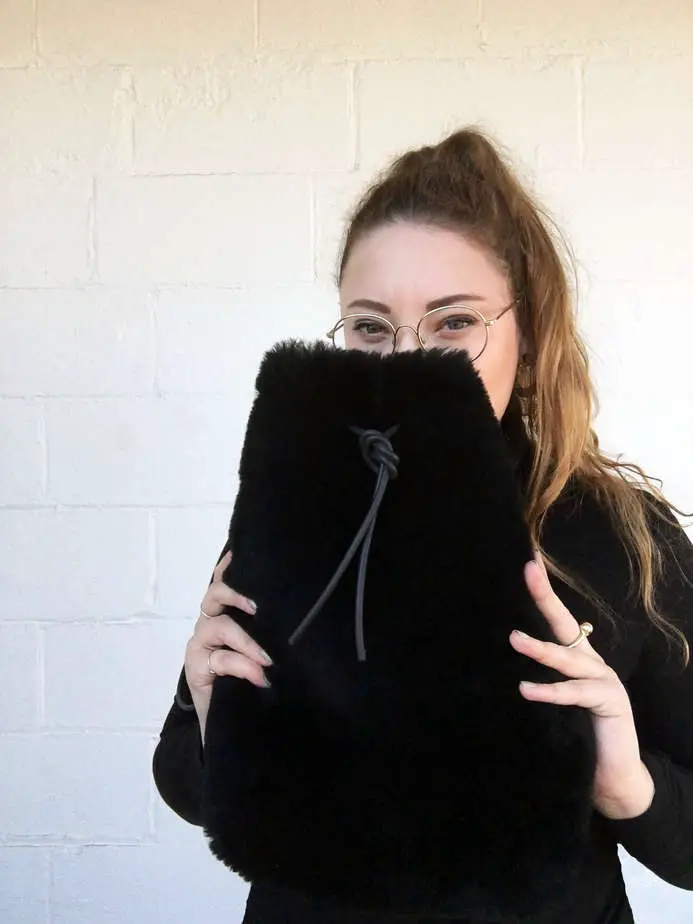 The designer, Hannah Emile with one of her bags.