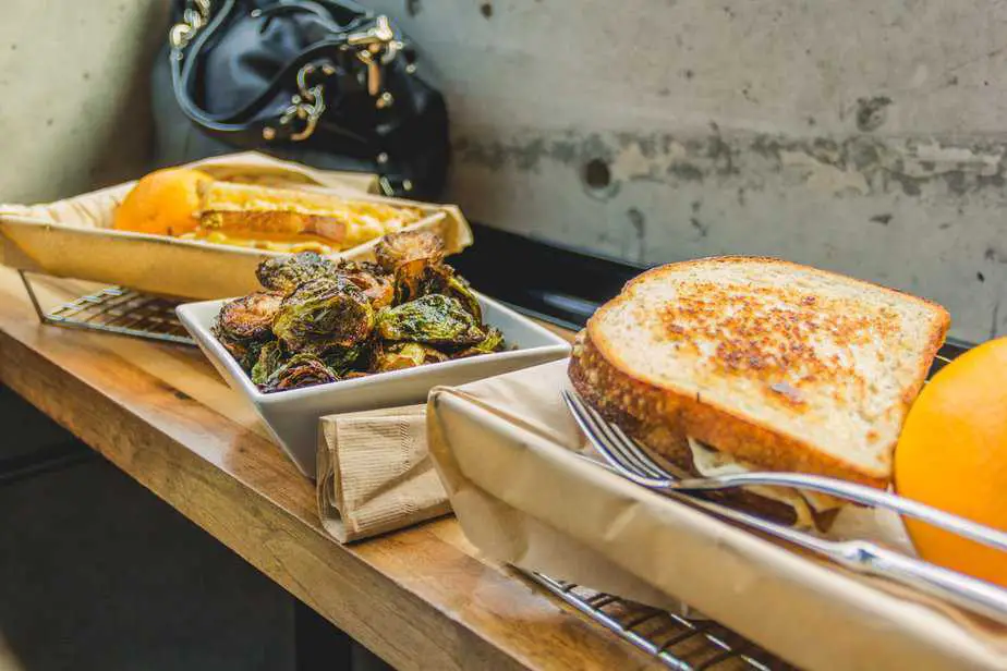 The American Grilled Cheese Kitchen with their grilled cheeses and maple sprouts, photography by Isaac Del Toro