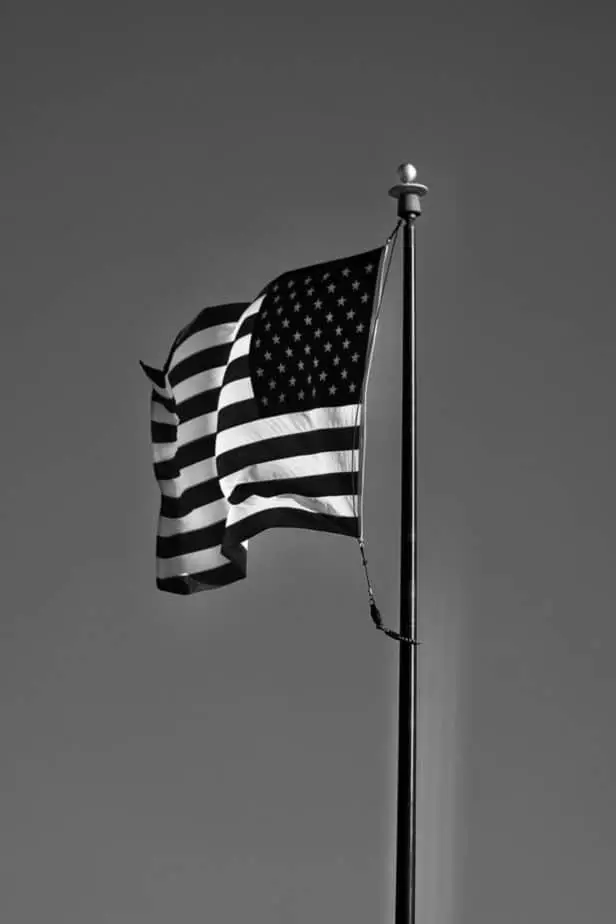 What does a black and white American flag symbolize?