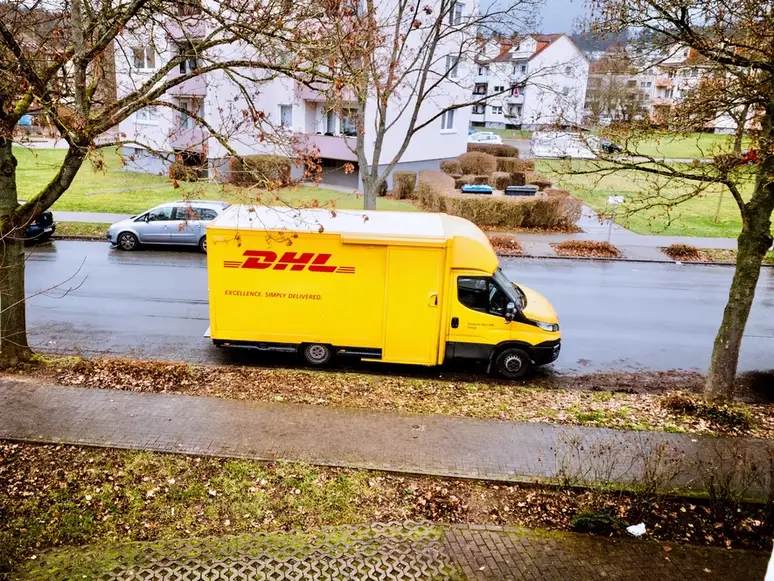 DHL With The Delivery Courier 
